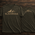 Green t-shirt with 'Blackridge' logo on a wooden surface