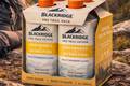 Blackridge endurance and hydration drinks in a packaging on a mountain background